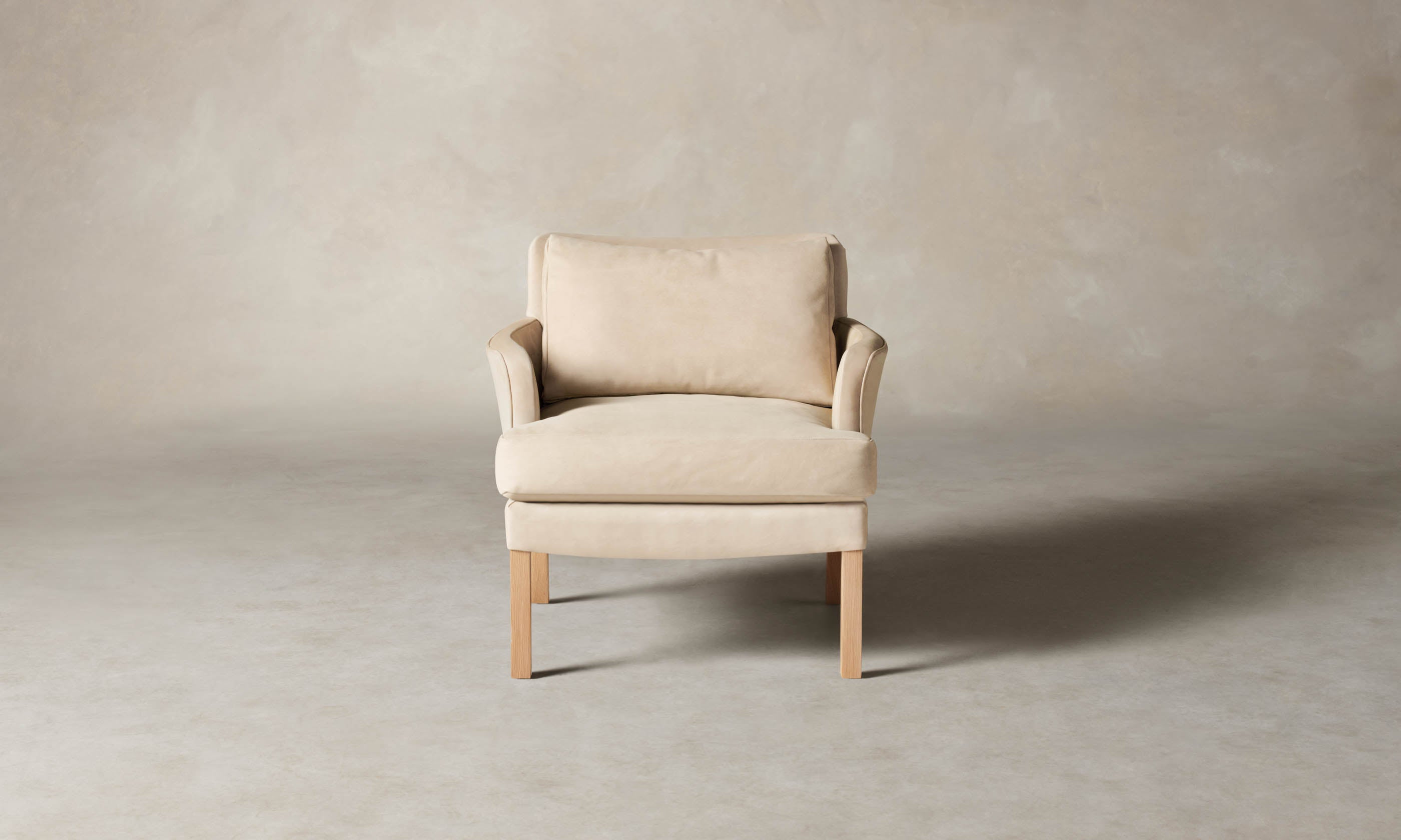 kaye leather accent chair in grey nubuck leather with wooden legs, front view