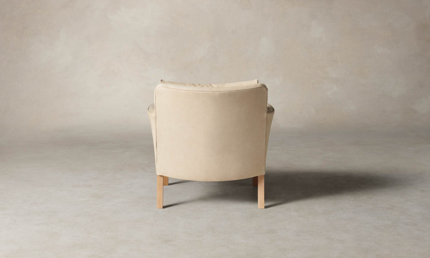 kaye leather accent chair in grey nubuck leather with wooden legs, back view