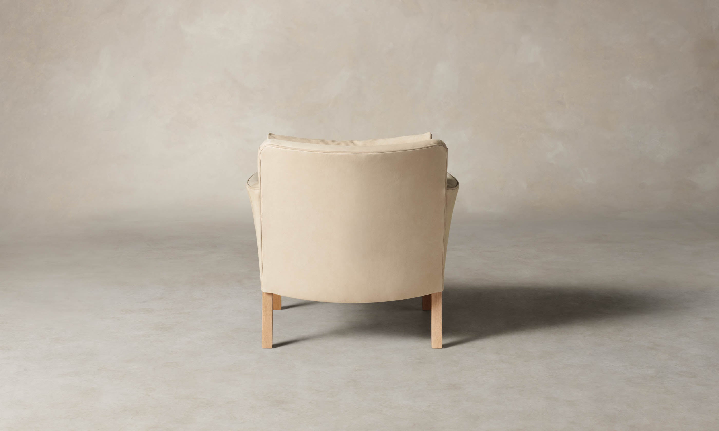 kaye leather accent chair in grey nubuck leather with wooden legs, back view
