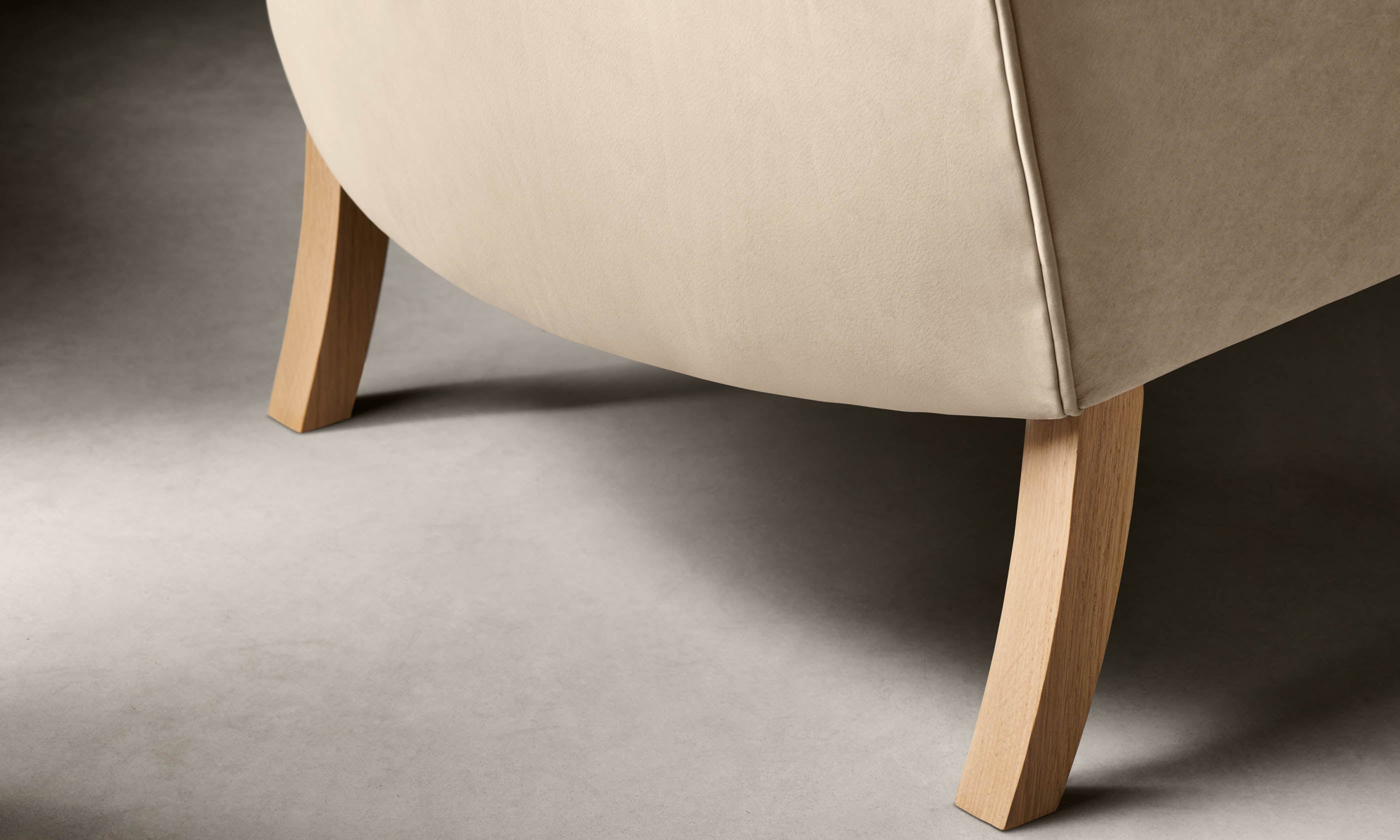 kaye leather accent chair in grey nubuck leather with oak legs, close up