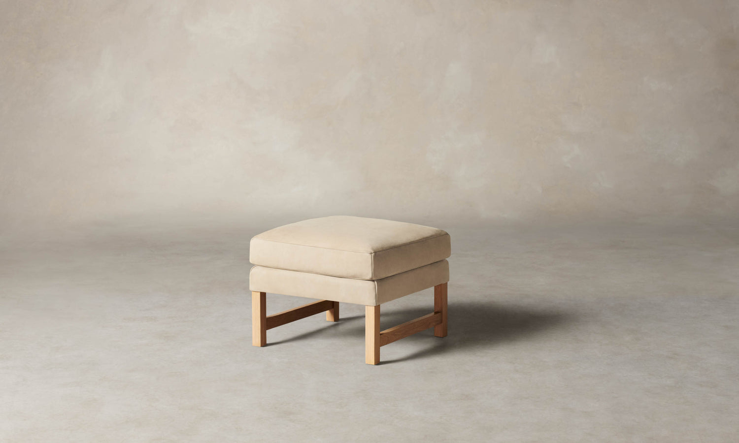 kaye leather ottoman in grey nubuck leather with wooden legs