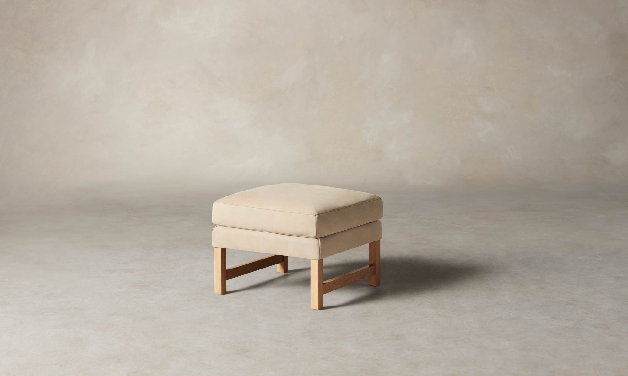 kaye leather ottoman in grey nubuck leather with wooden legs
