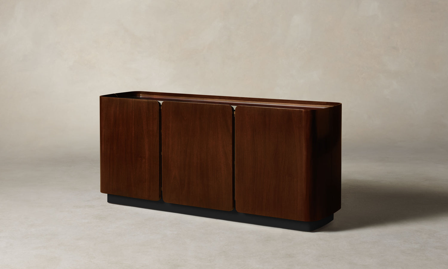 sabine dark oak wood sideboard with three doors and a glass top, angle view