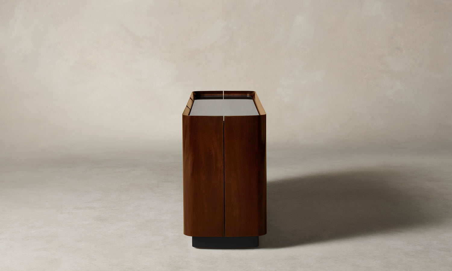 sabine dark oak wood sideboard with three doors and a glass top, side view