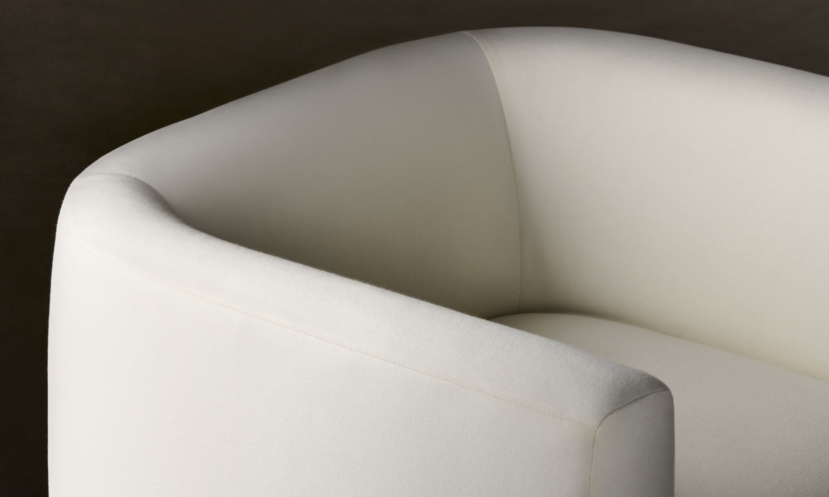 henri white wool swivel chair with wood accent, close up view