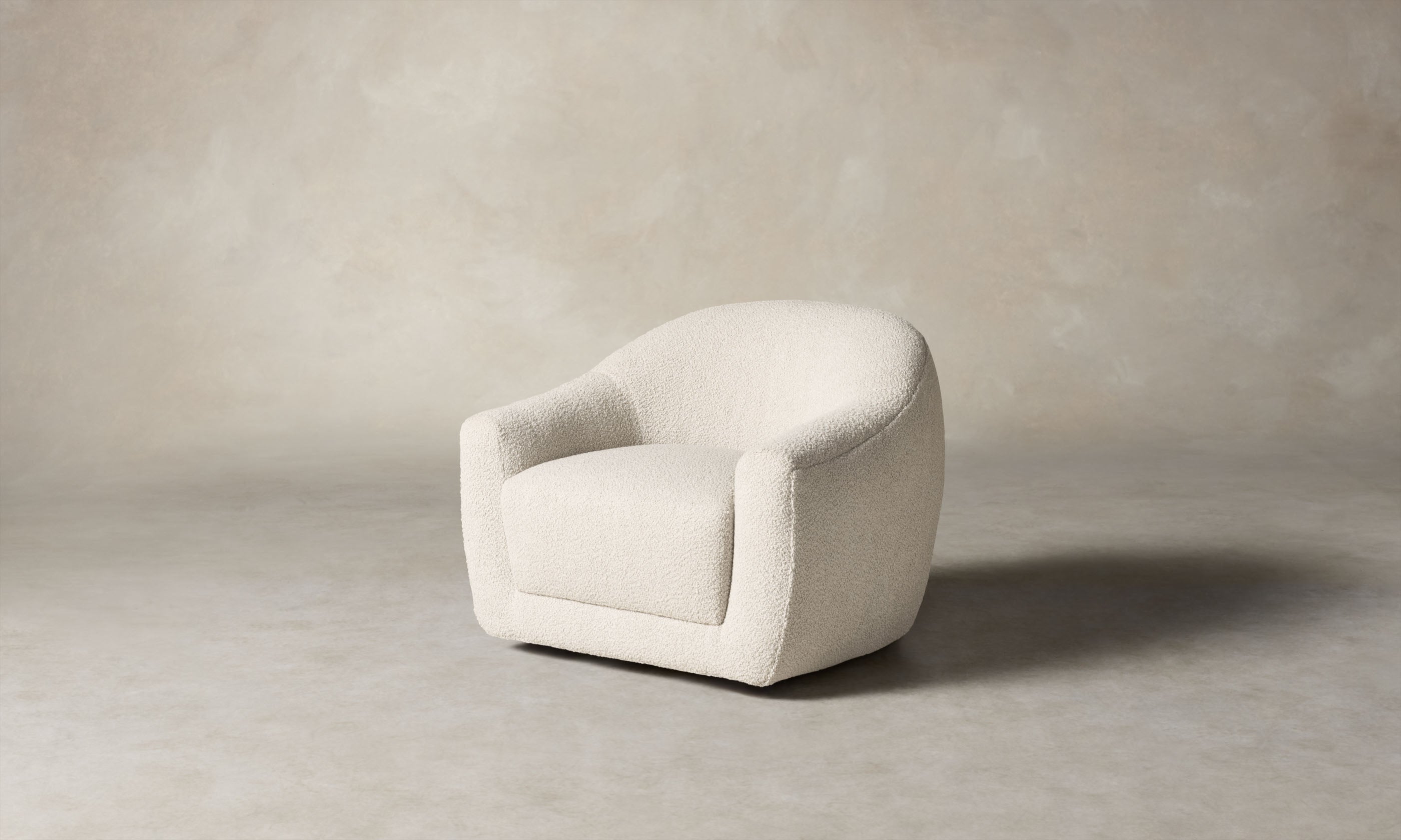 oliver accent chair in white boucle with curved back, angle view