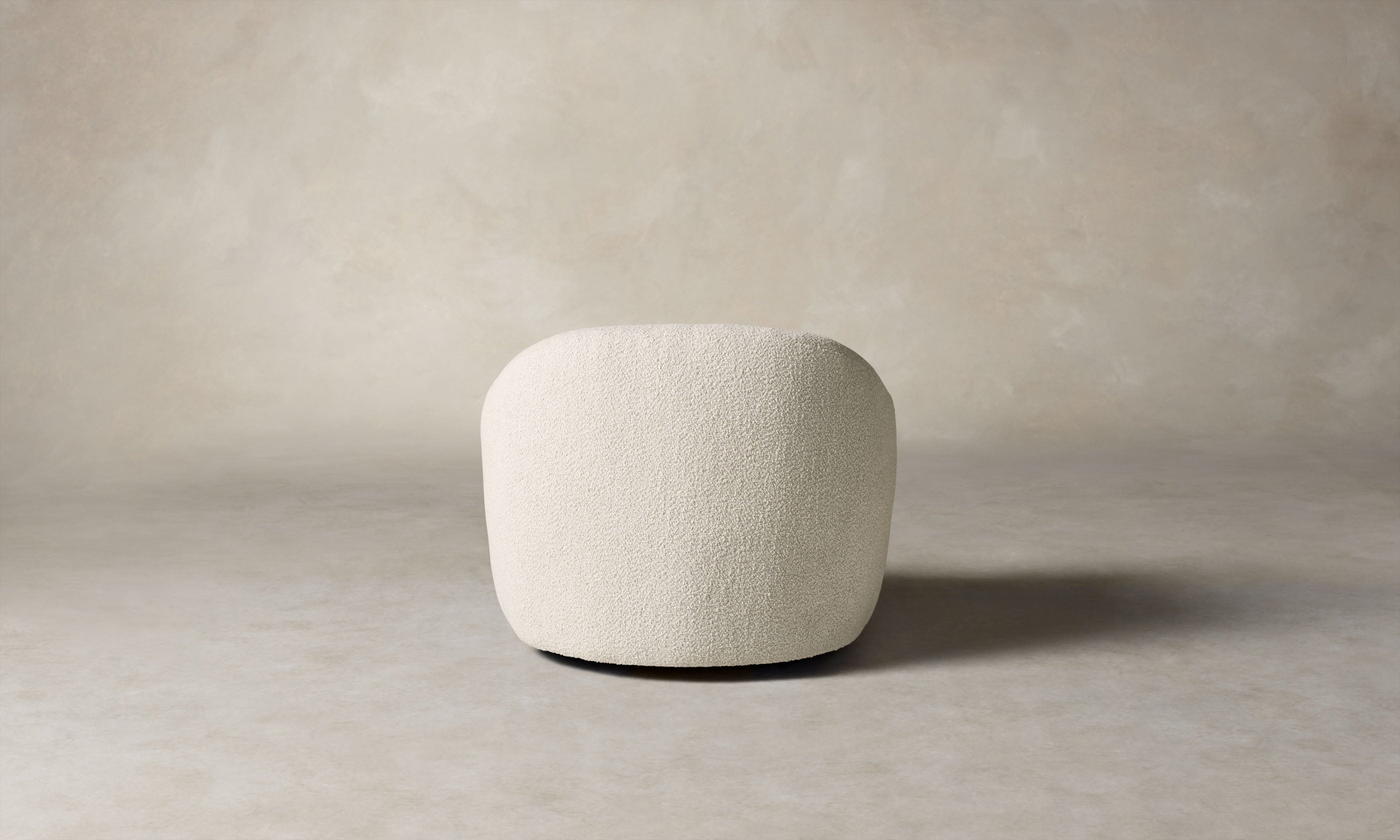 oliver accent chair in white boucle with curved back, back view