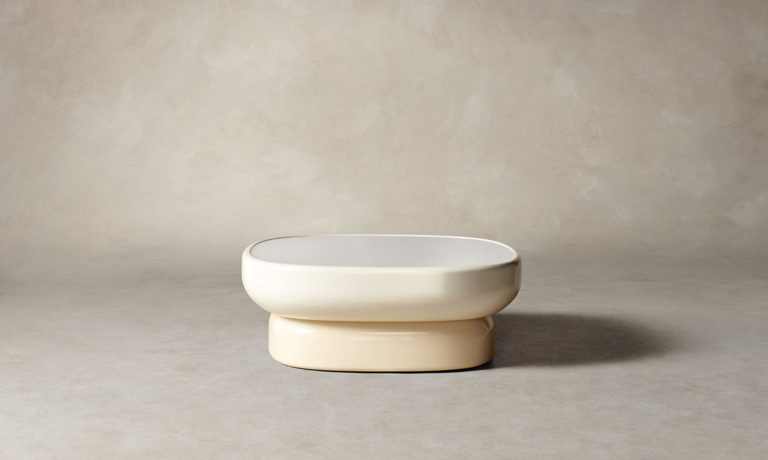 emile oval glass coffee table with lacquered beige base and white opaque glass top in art deco style