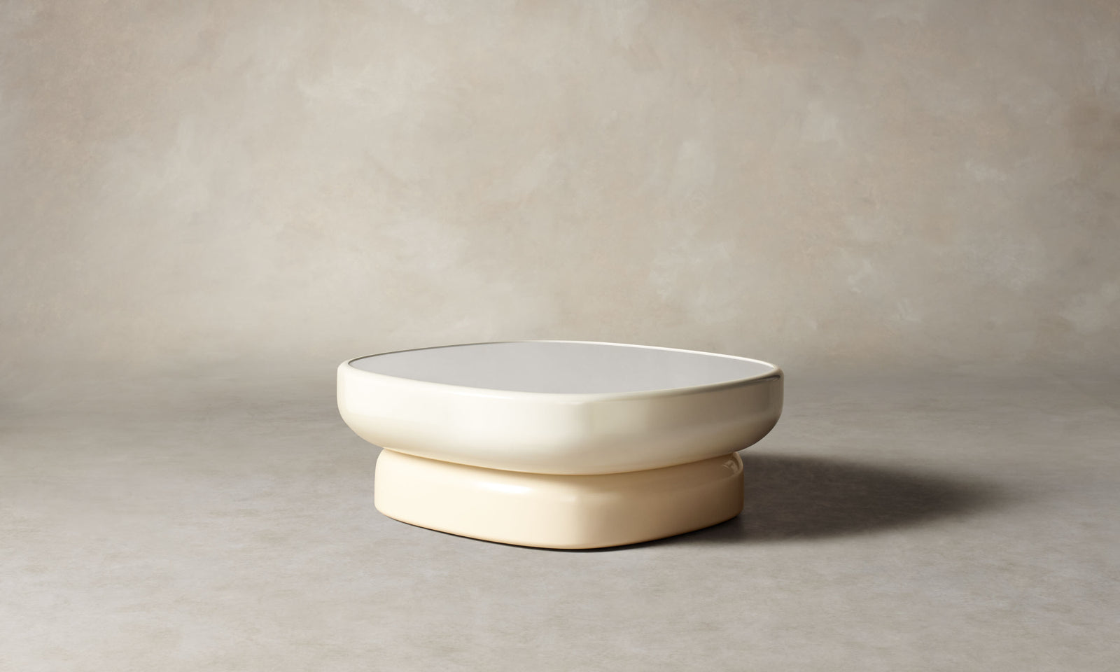 emile glass coffee table with lacquered beige base and white opaque glass top in art deco style