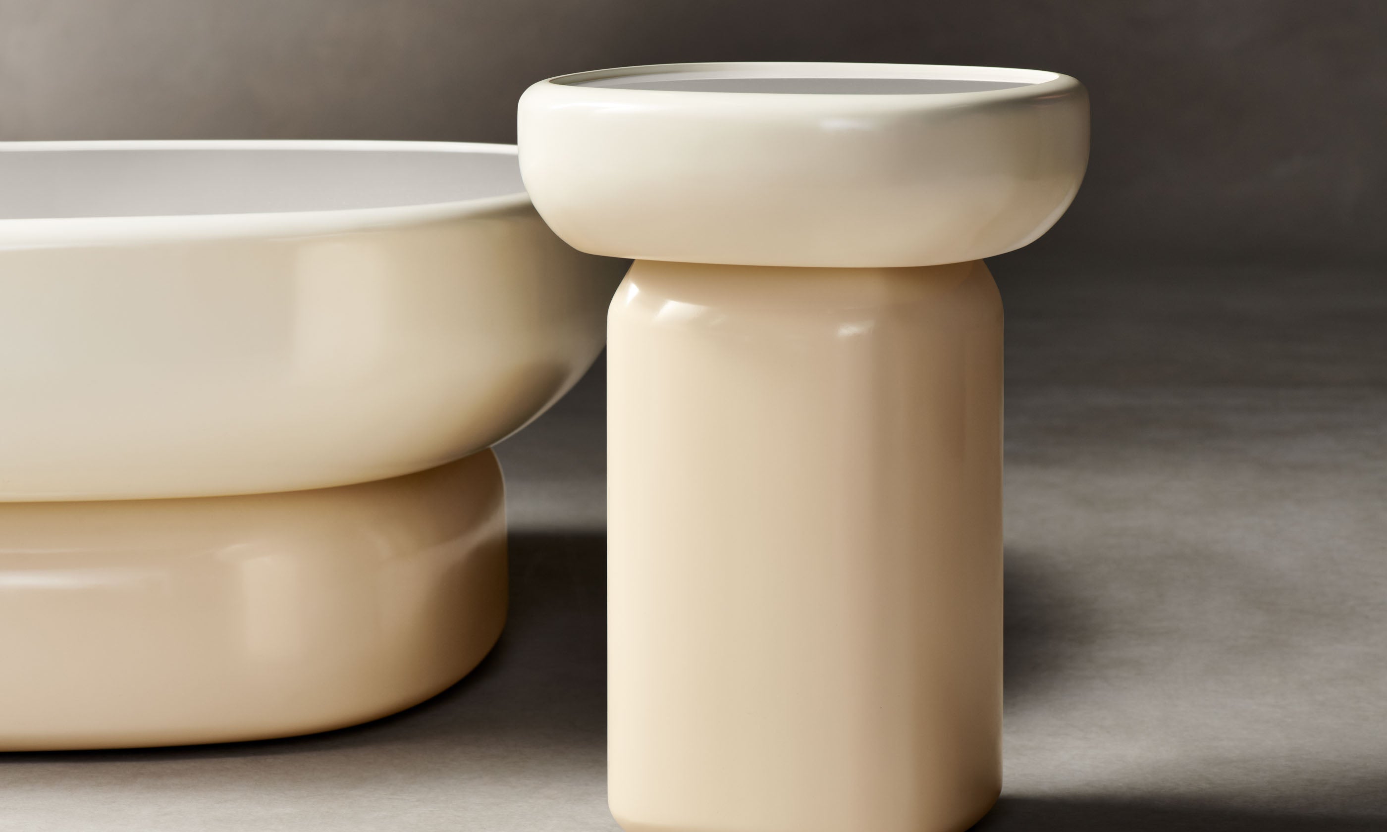 emile oval glass coffee table and side table with lacquered beige base and white opaque glass top in art deco style