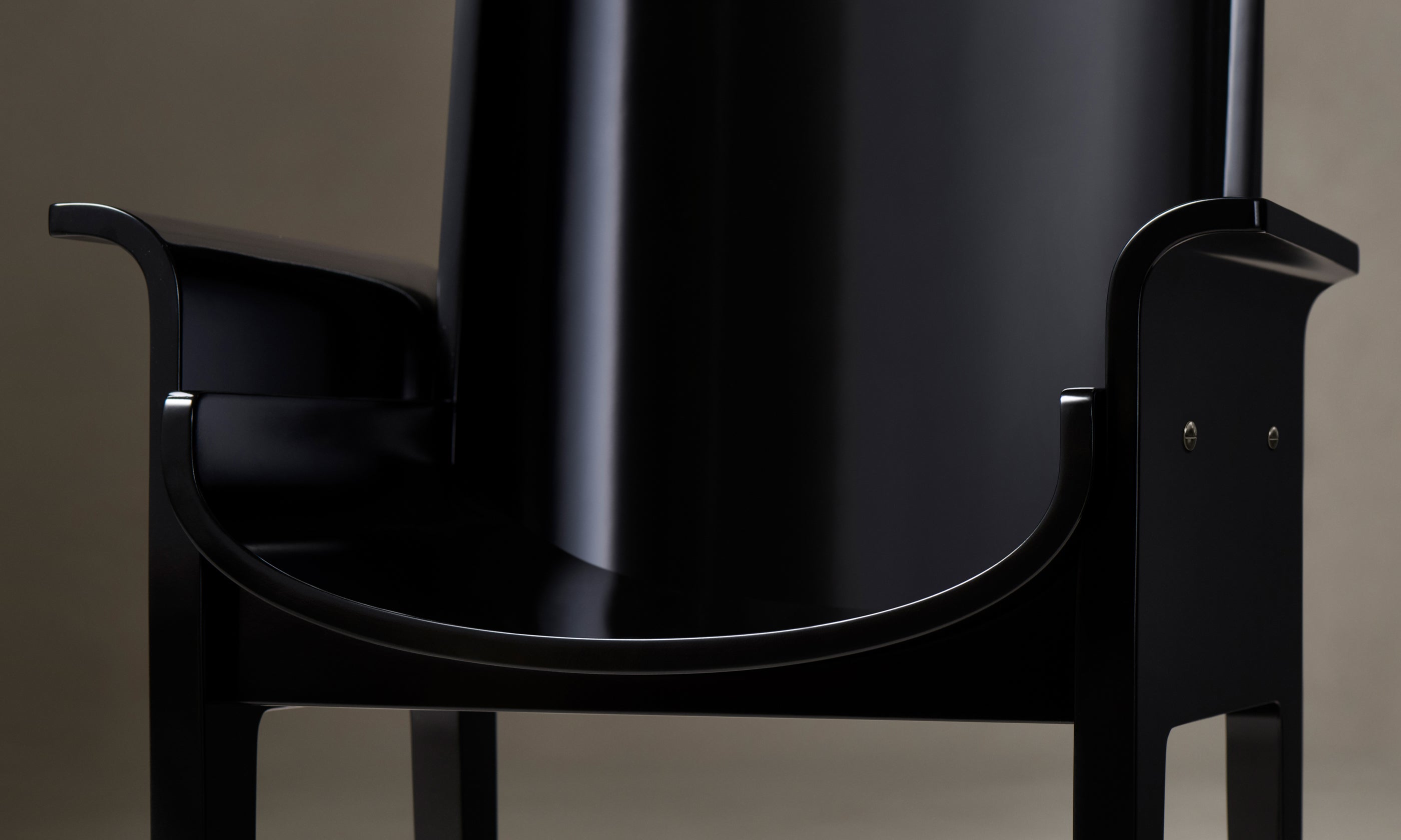 leon black lacquered dining armchair, close up view
