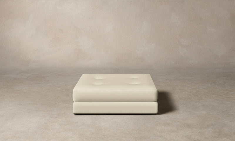 The Forma Ottoman - Pebbled Leather Swan