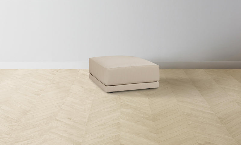 The Jones Ottoman - Pebbled Leather Stone