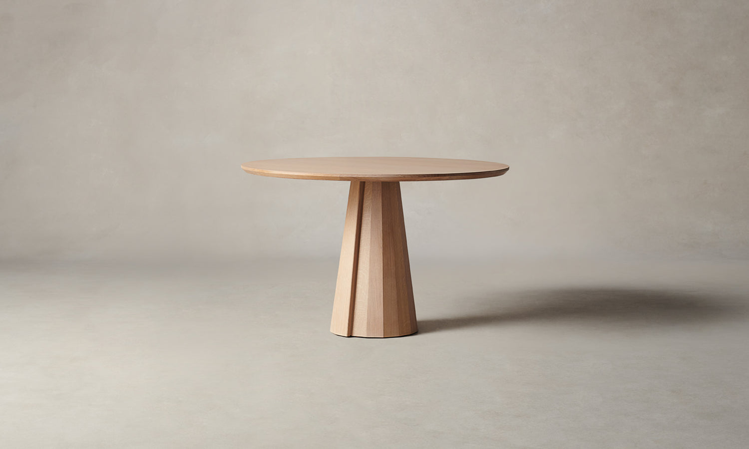 bank round wood dining table in natural oak