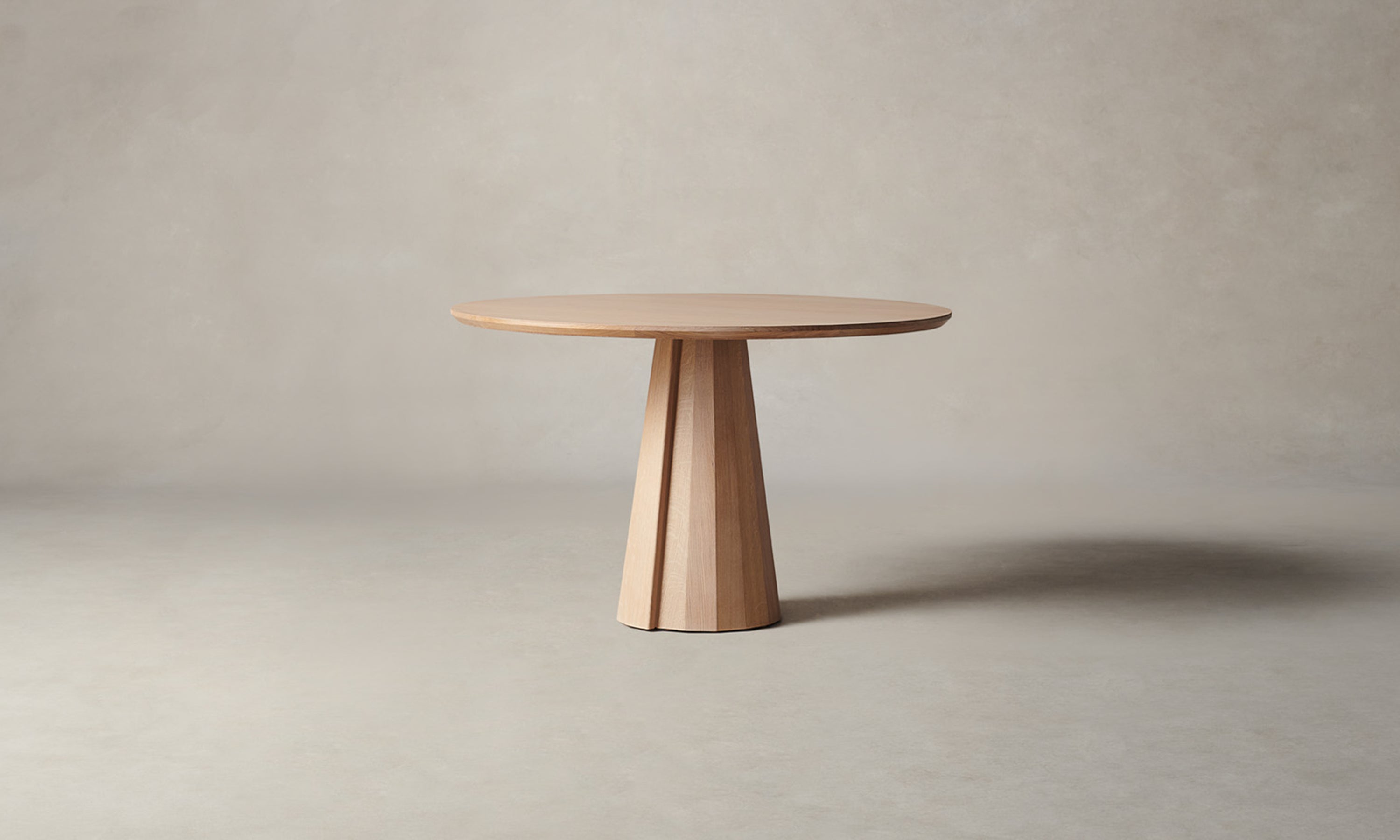 bank round wood dining table in natural oak