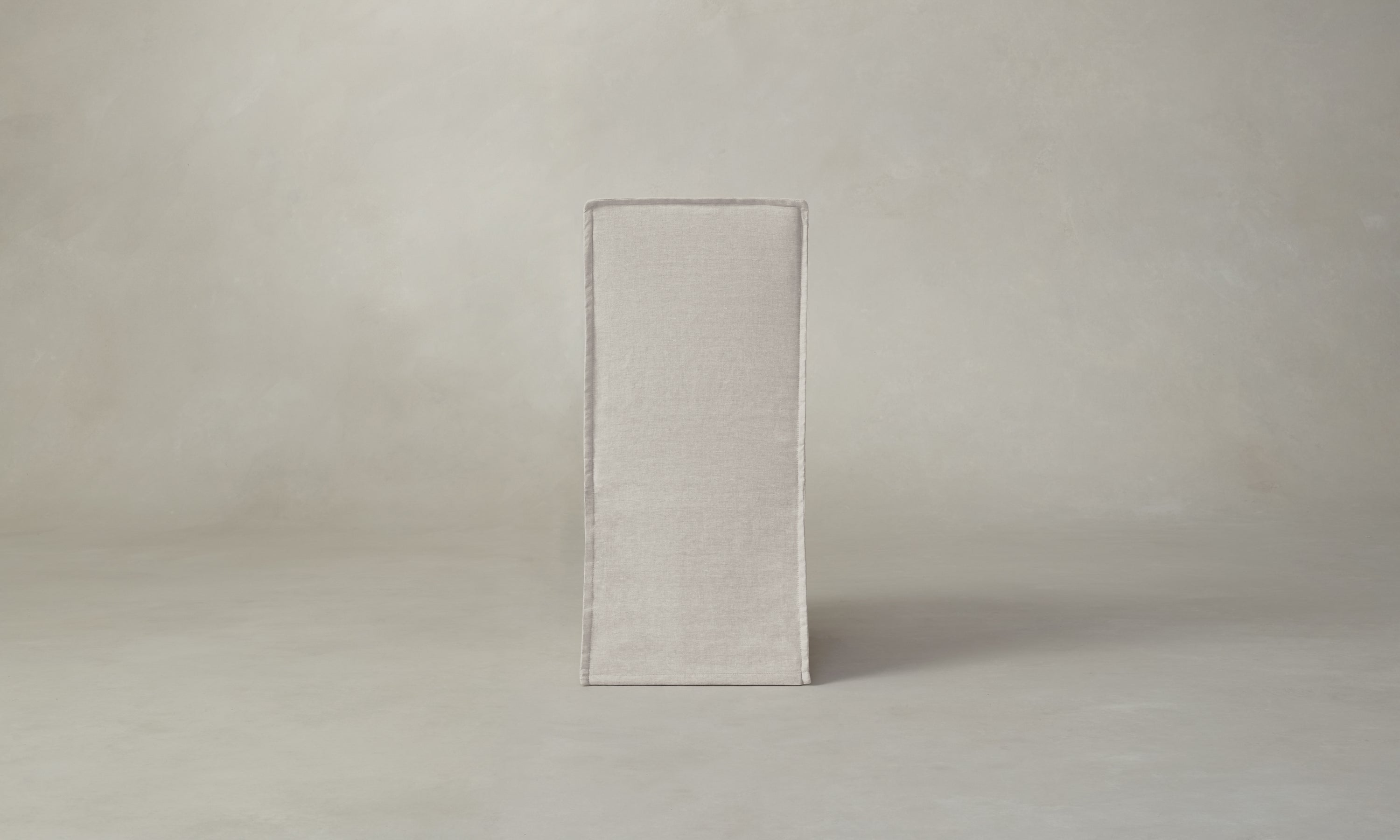 beacon slipcovered dining chair in white linen, back view
