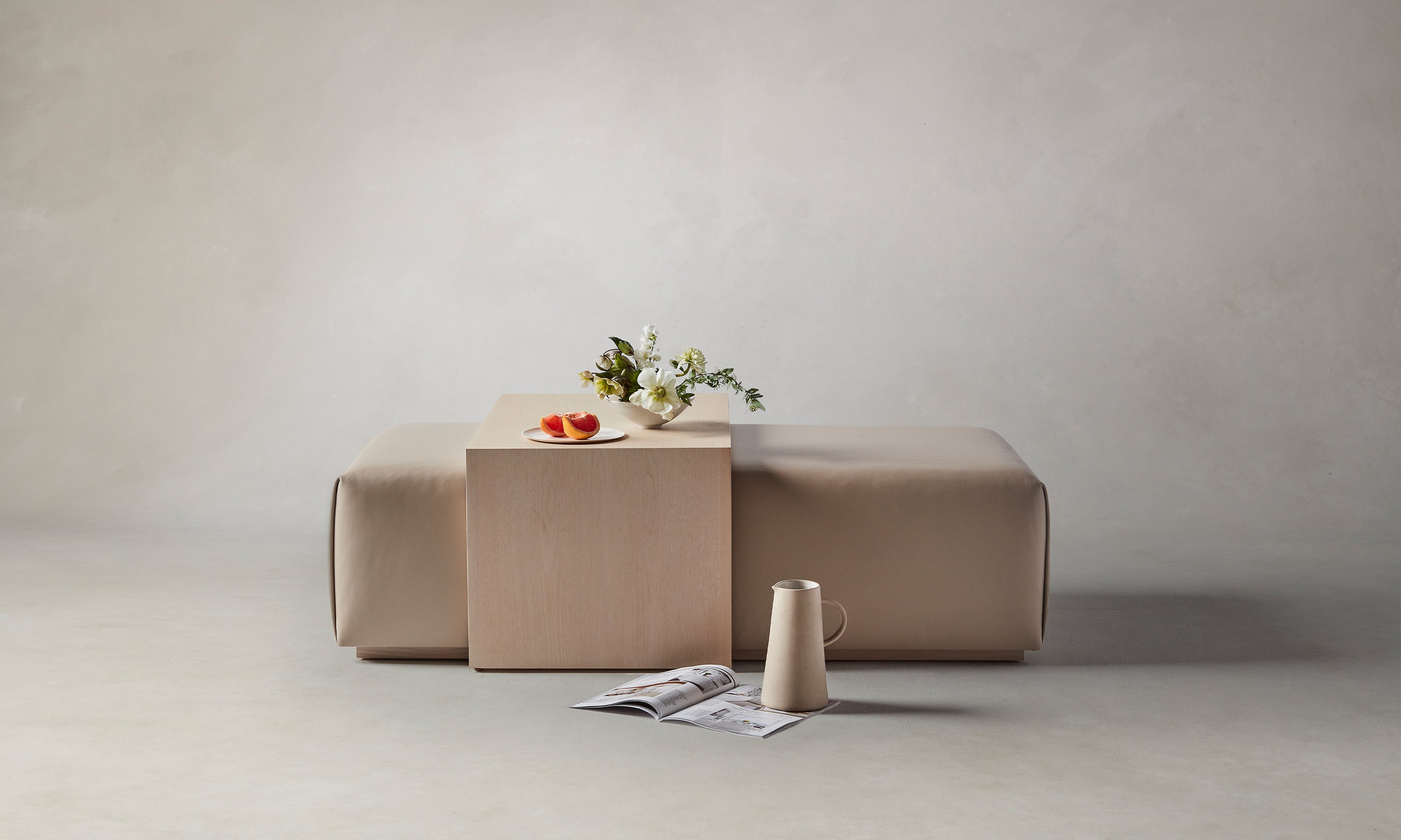 bowery ottoman with wood tray in beige stone leather and ash wood