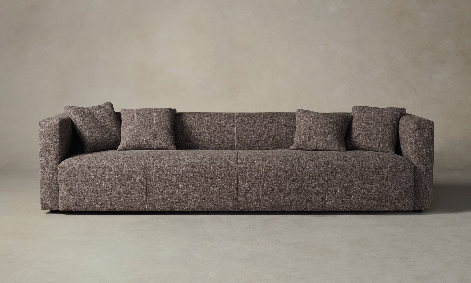 breuer sofa in brown chambray linen with throw pillows