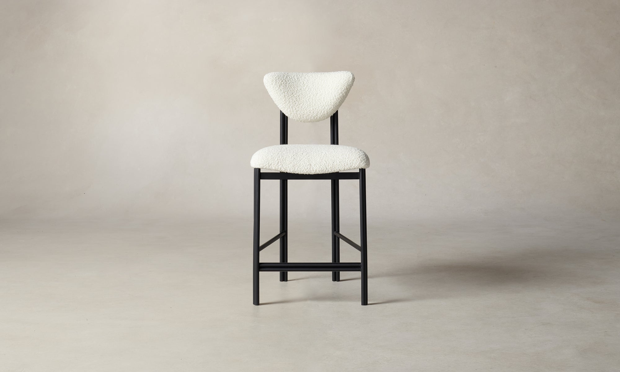 cooper counter stool in white boucle with metal frame and back rest