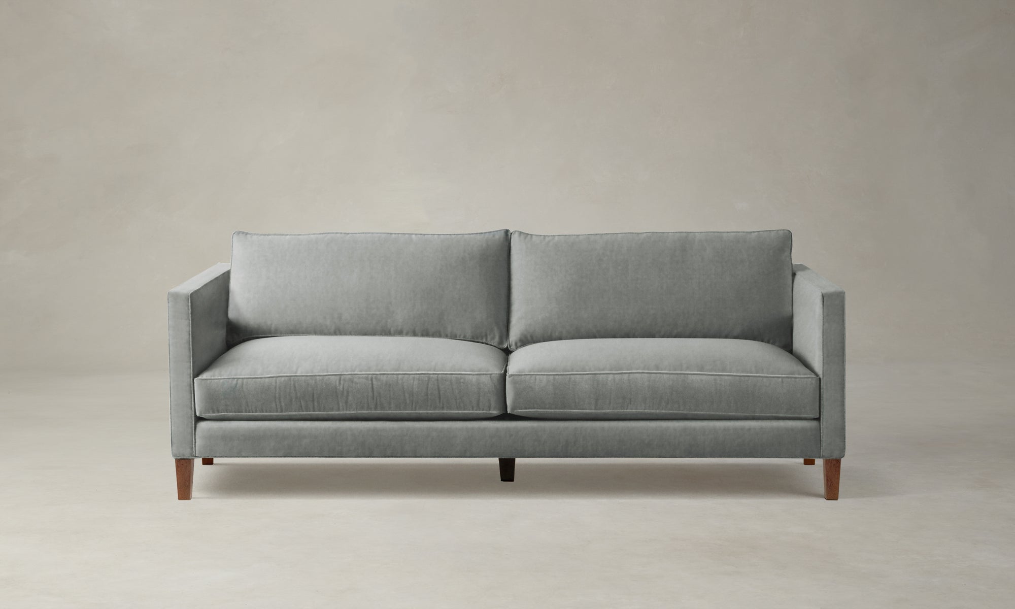 crosby sofa in velvet seafoam green with wooden legs