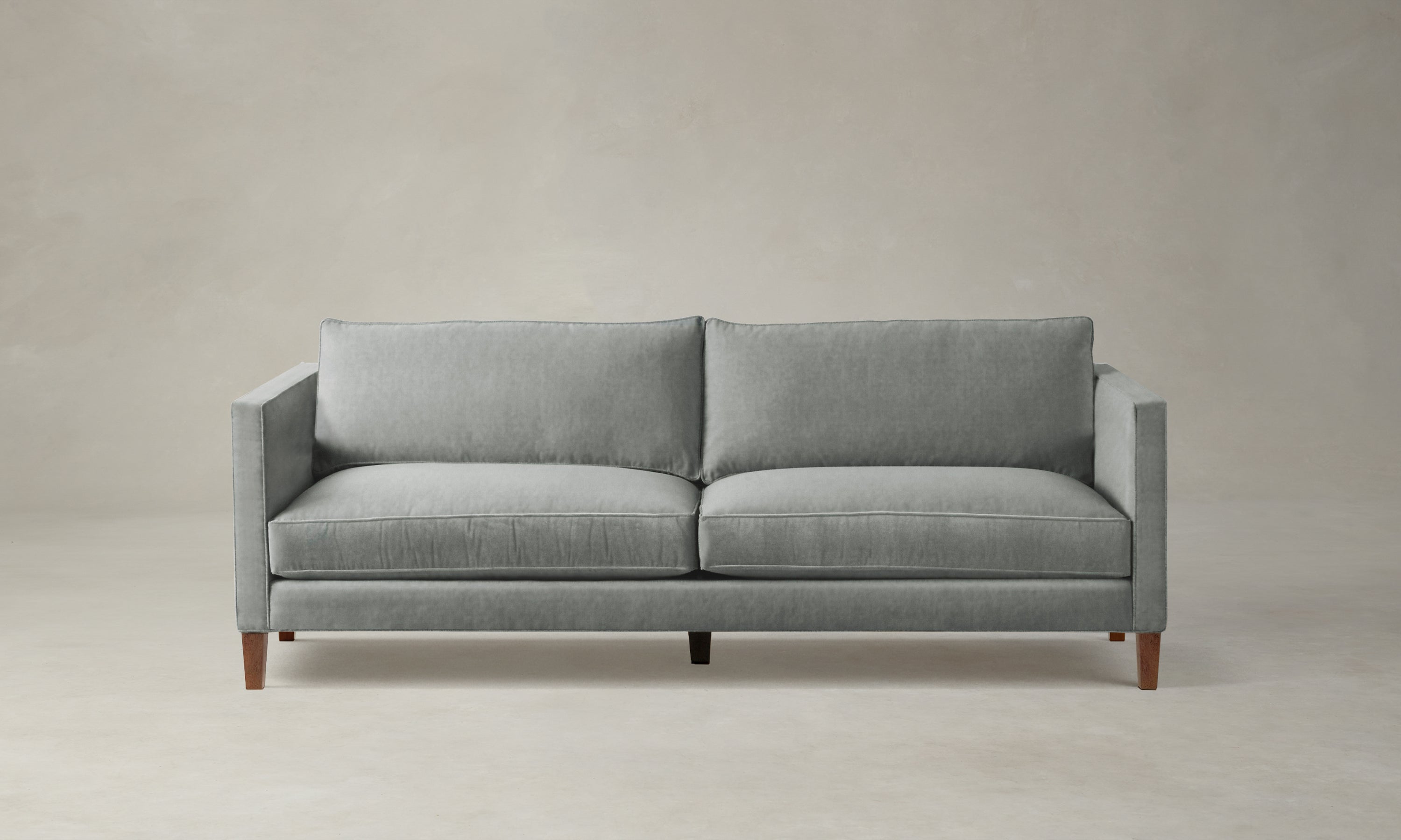 crosby sofa in velvet seafoam green with wooden legs
