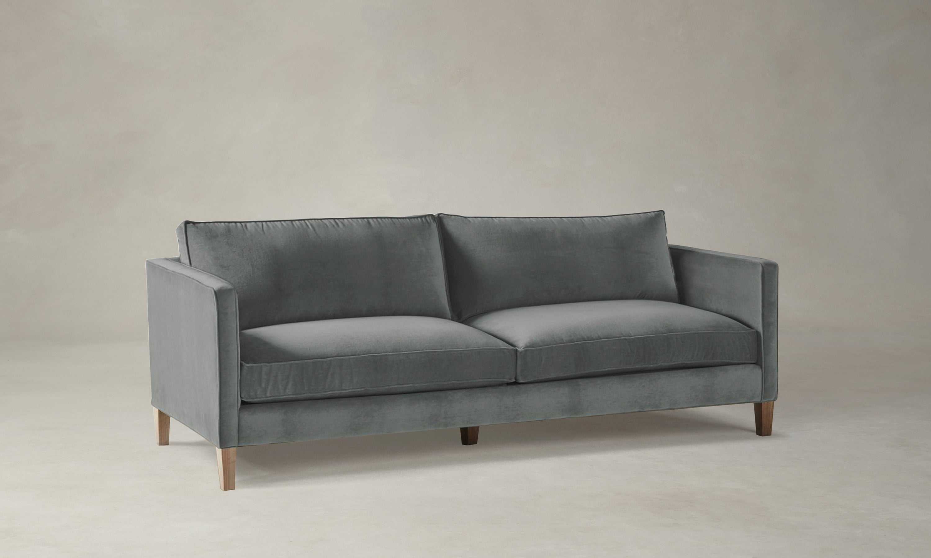 crosby sofa in velvet gray with wooden legs