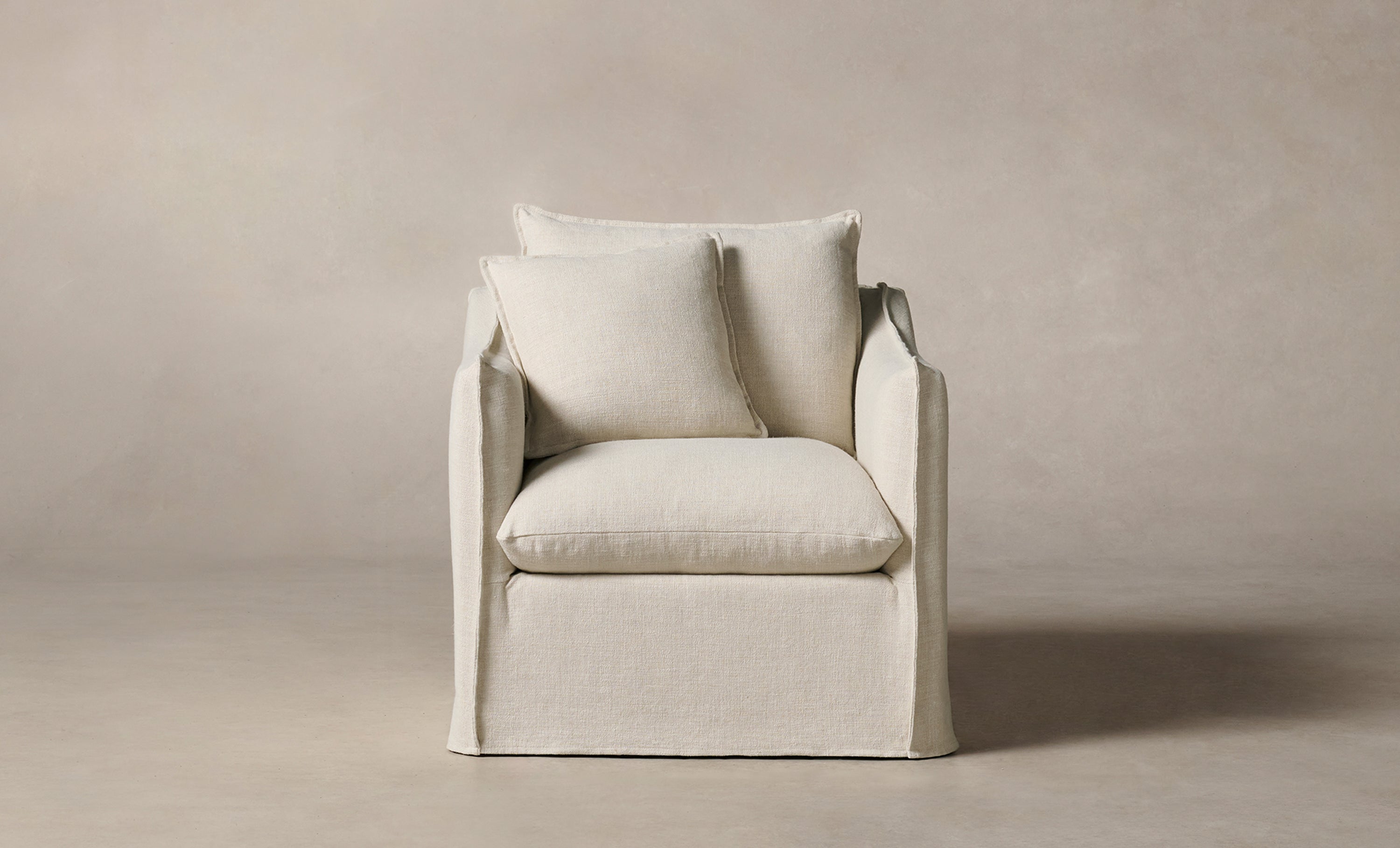 dune white linen upholstered accent chair with cushions