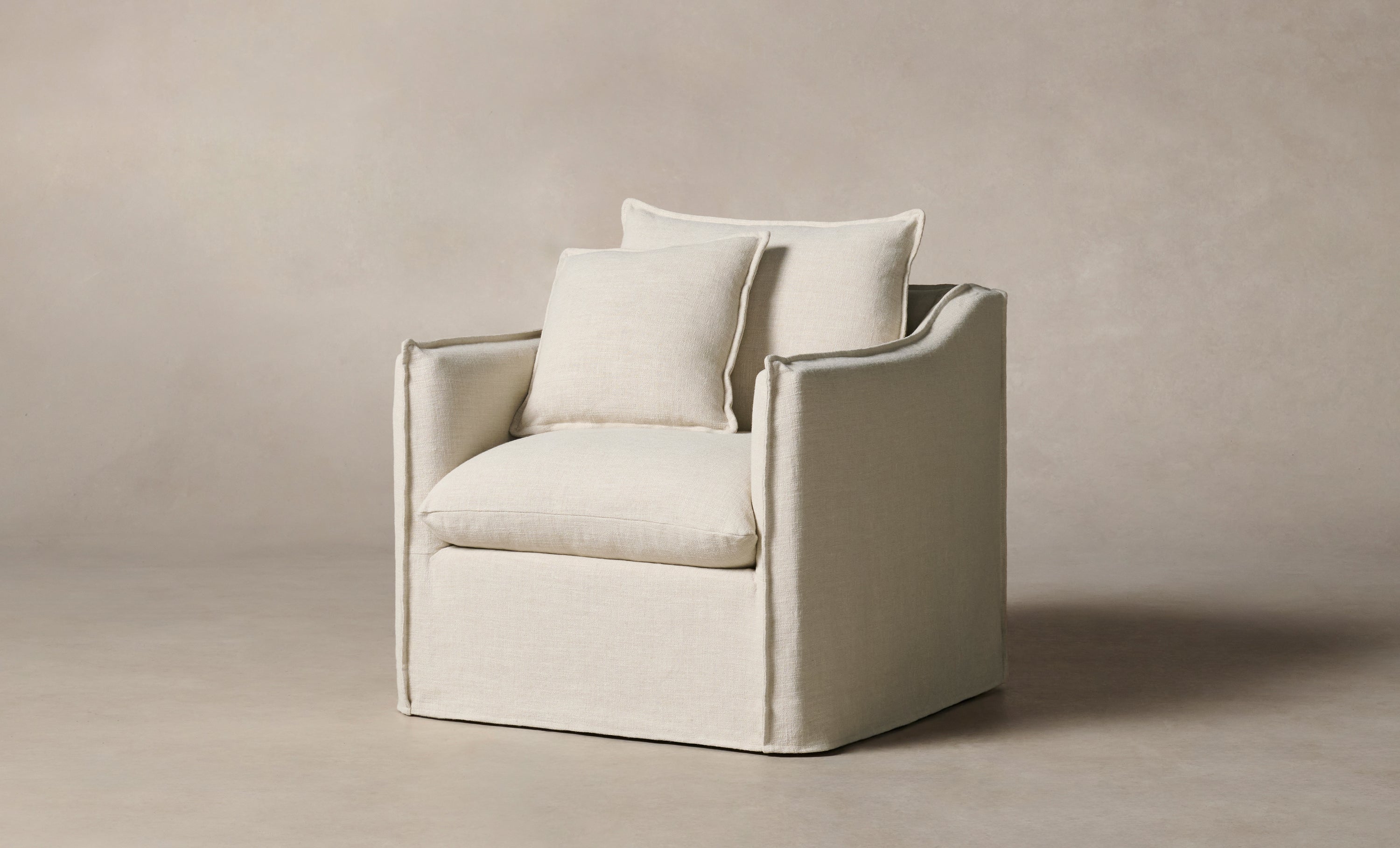 dune white linen swivel accent chair with cushions