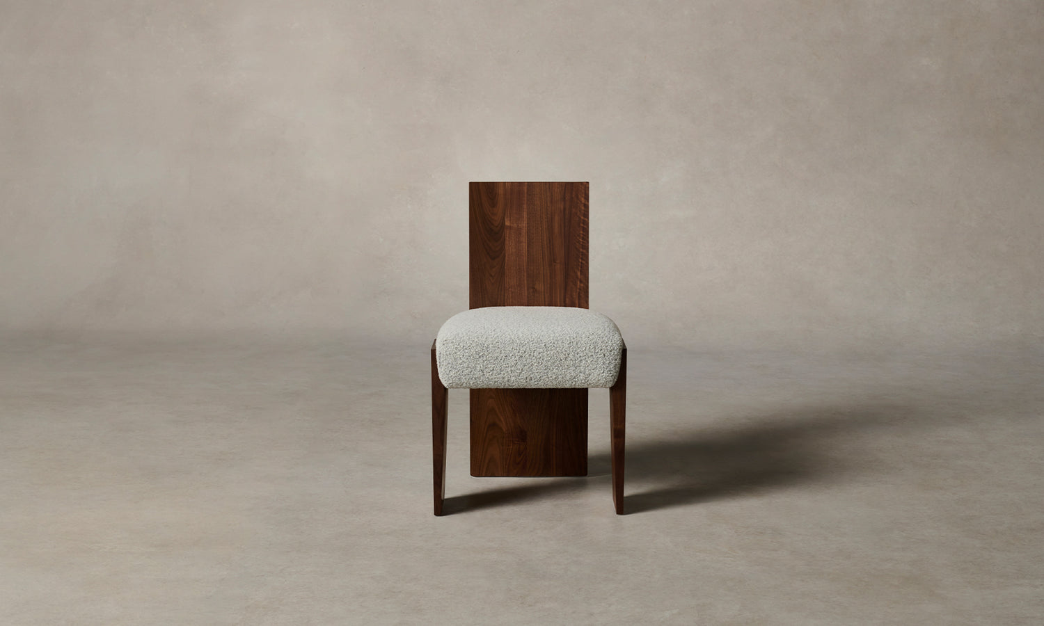 garrett dining chair in brown walnut wood and grey boucle fabric