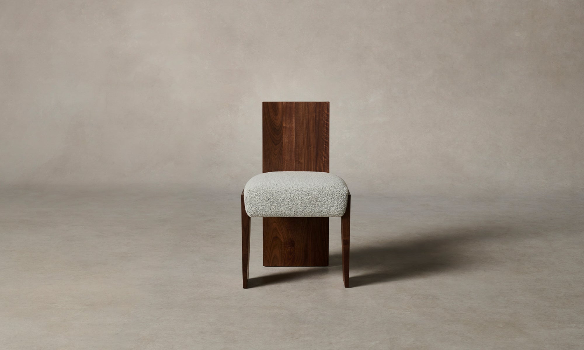 garrett dining chair in brown walnut wood and grey boucle fabric