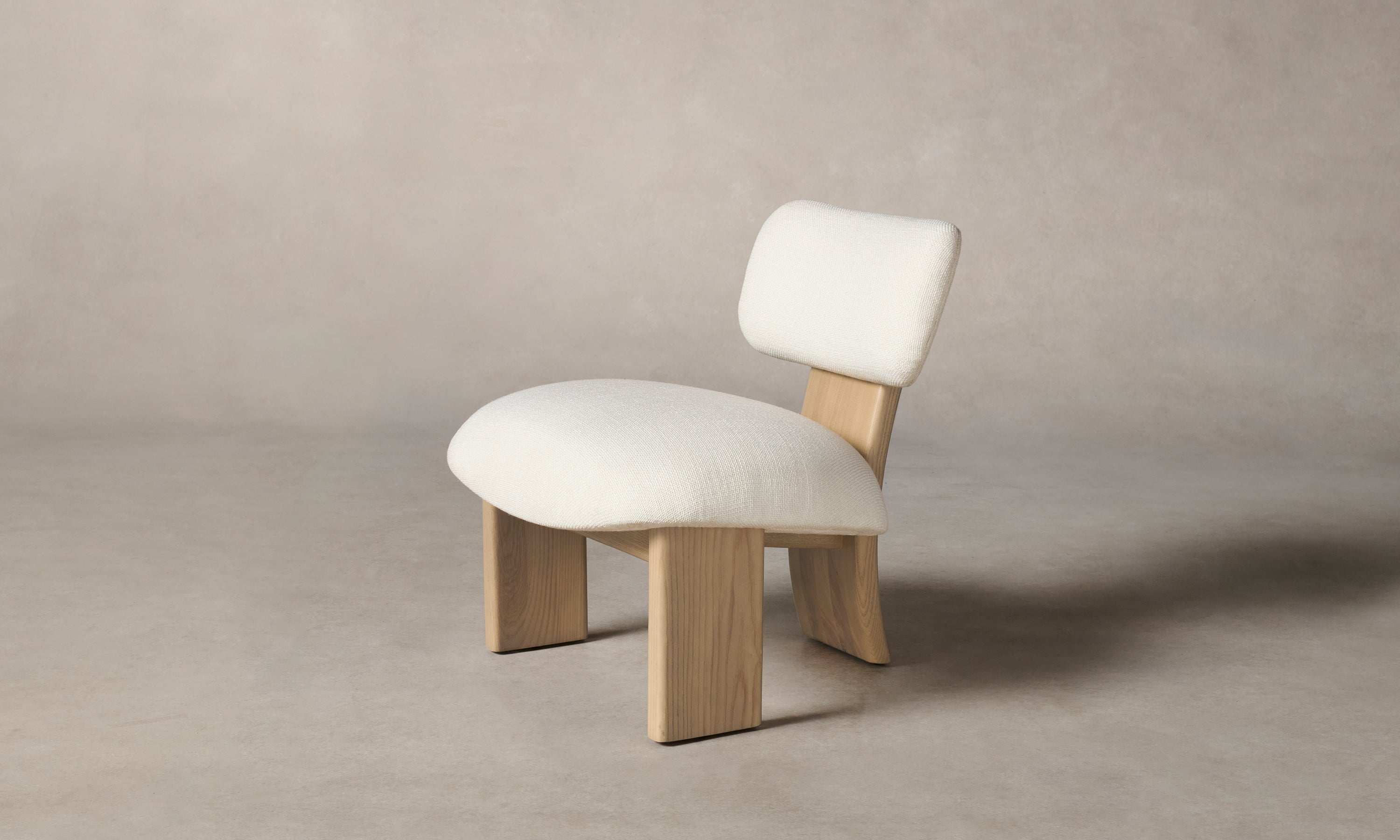 kenmare accent chair in white linen with ash wood frame and three legs