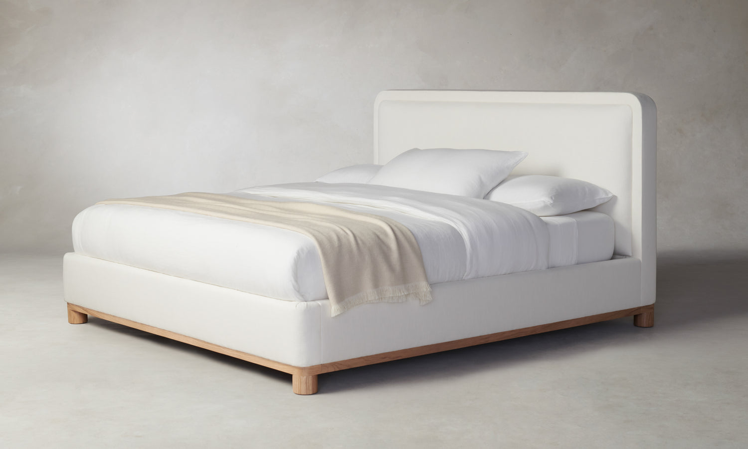 kent bed with upholstered frame and headboard in white linen with wood trim