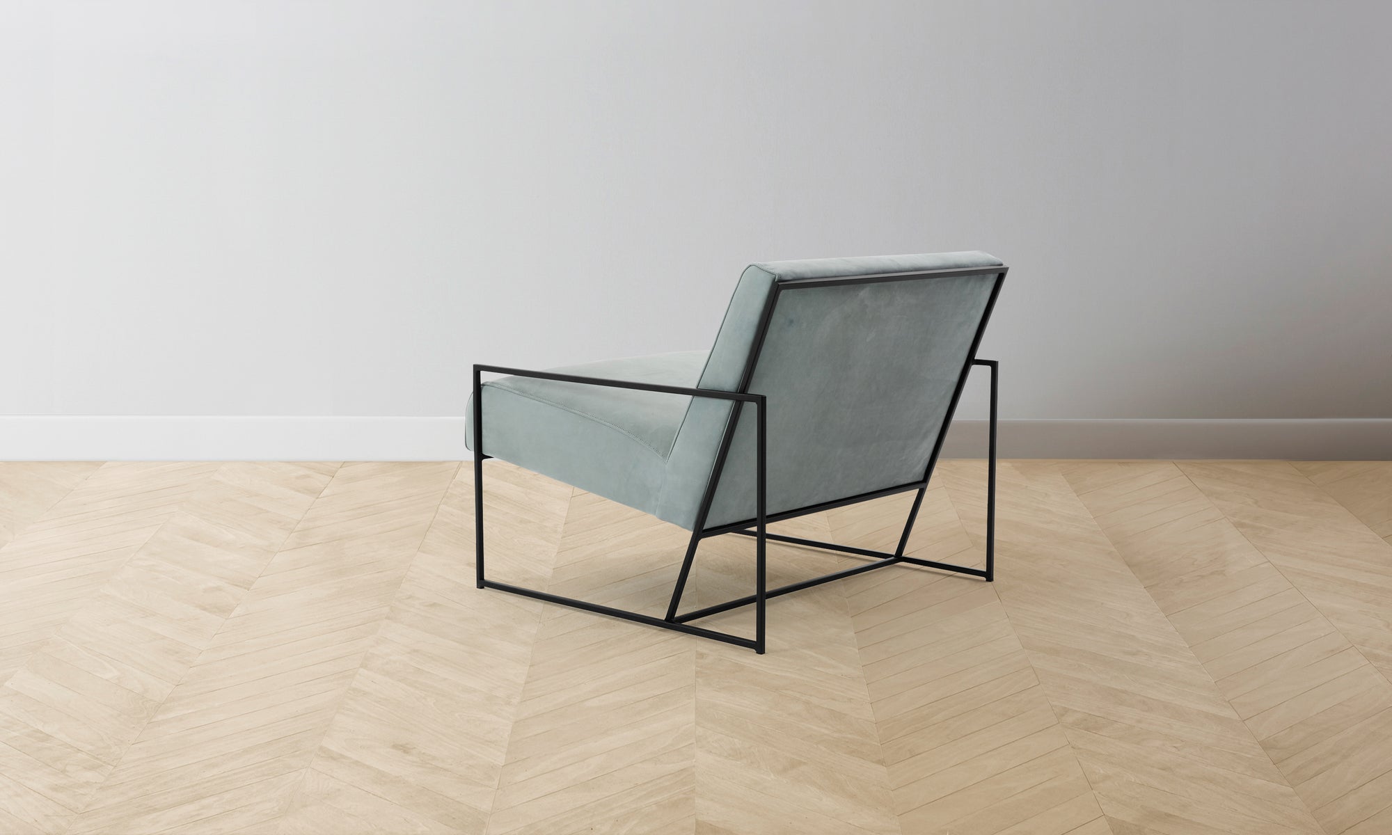 mercer geometric accent chair in blue nubuck leather with steel frame - back view