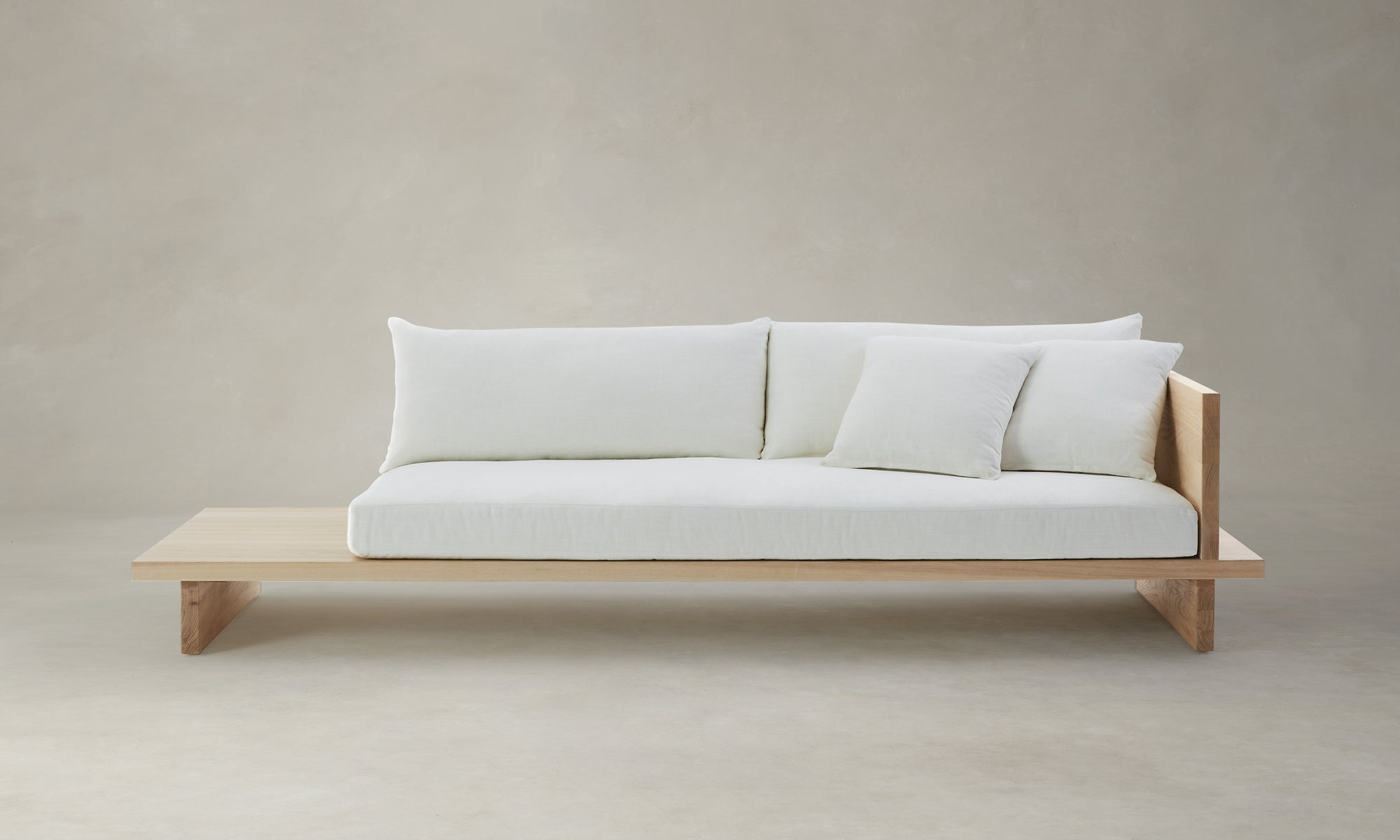 muir sofa with built in table in white chenille fabric and wooden trim