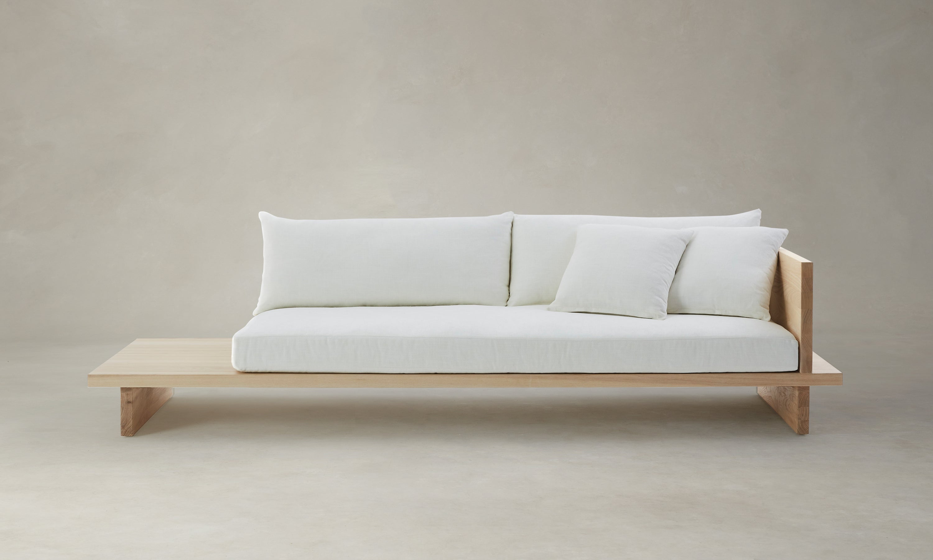 muir sofa with built in table in white chenille fabric and wooden trim