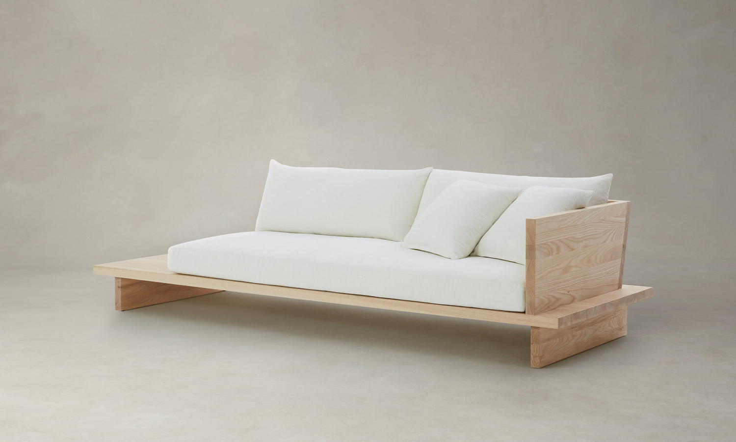 muir sofa with built in table in white chenille fabric and wooden frame - angle view