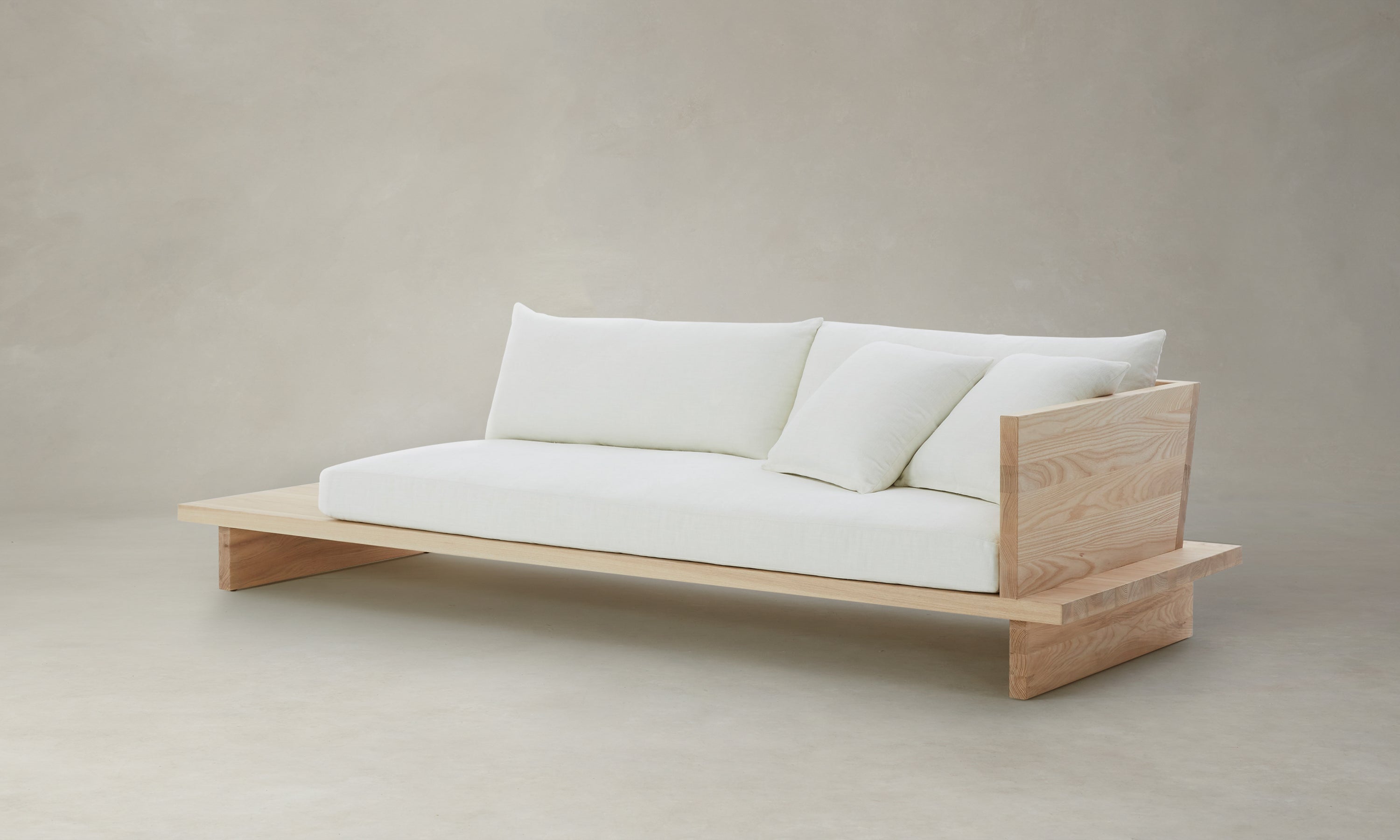 muir sofa with built in table in white chenille fabric and wooden frame - angle view