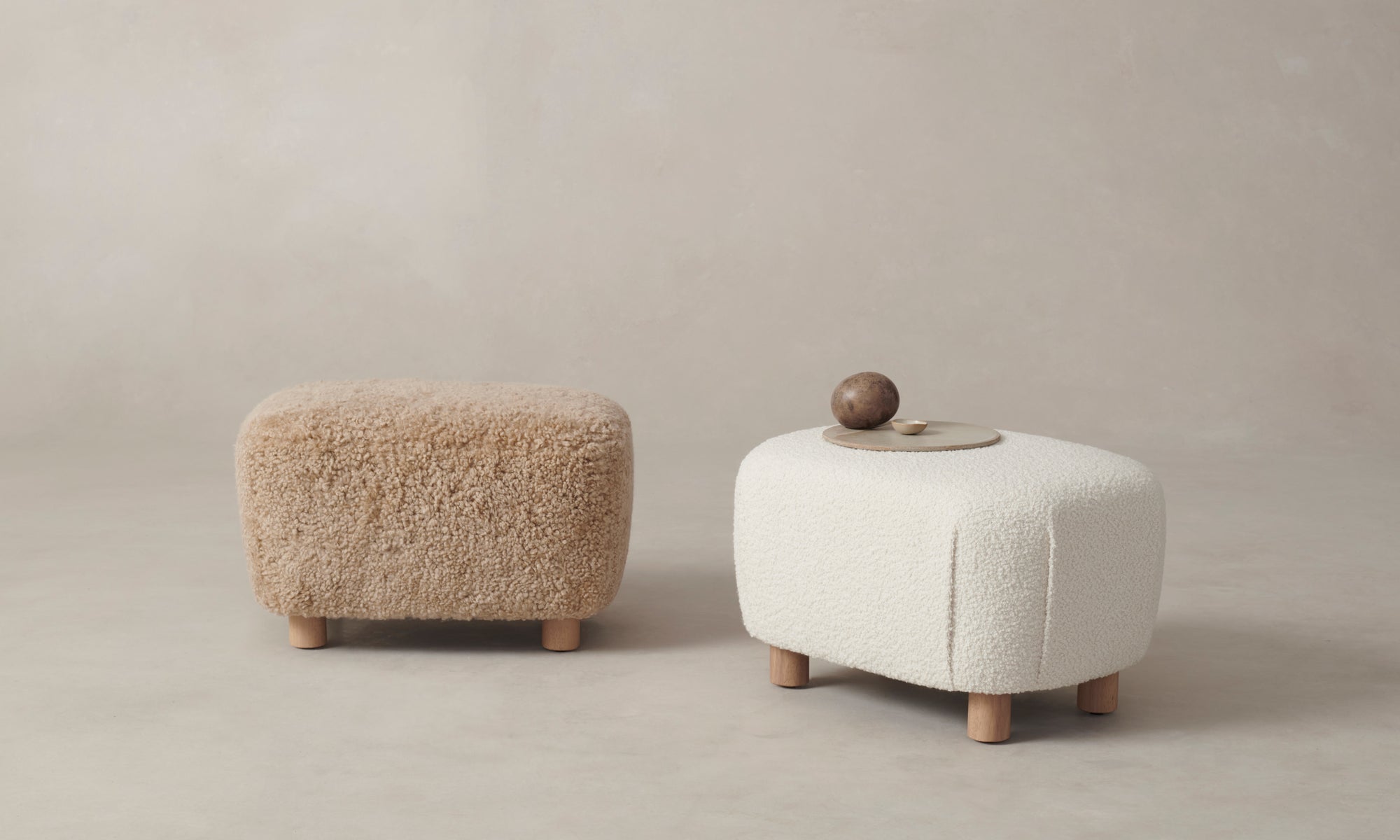 perry ottoman with maple wood legs and white boucle fabric and brown shearling fabric
