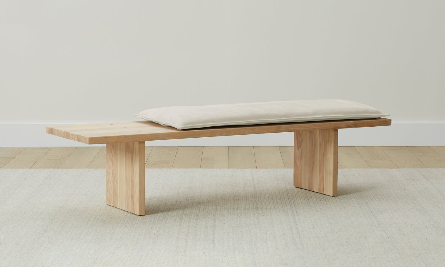 reyes wood bench with beige nubuck leather cushion