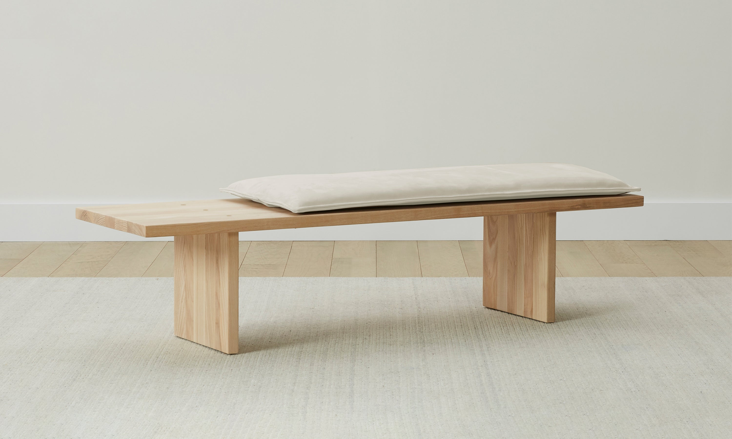 reyes wood bench with beige nubuck leather cushion