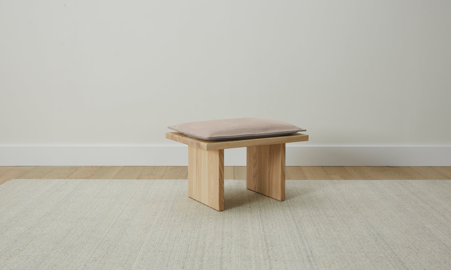 reyes wooden stool with gray leather cushion