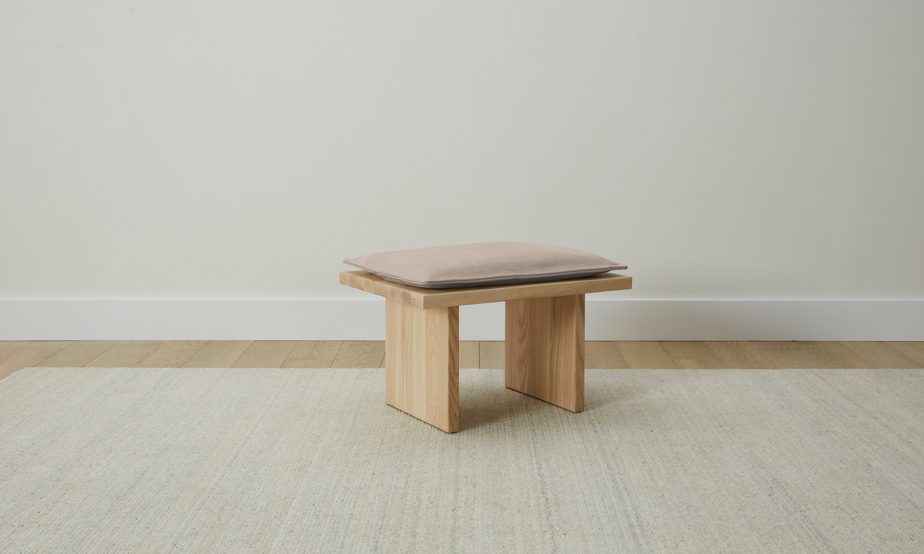reyes wooden stool with gray leather cushion