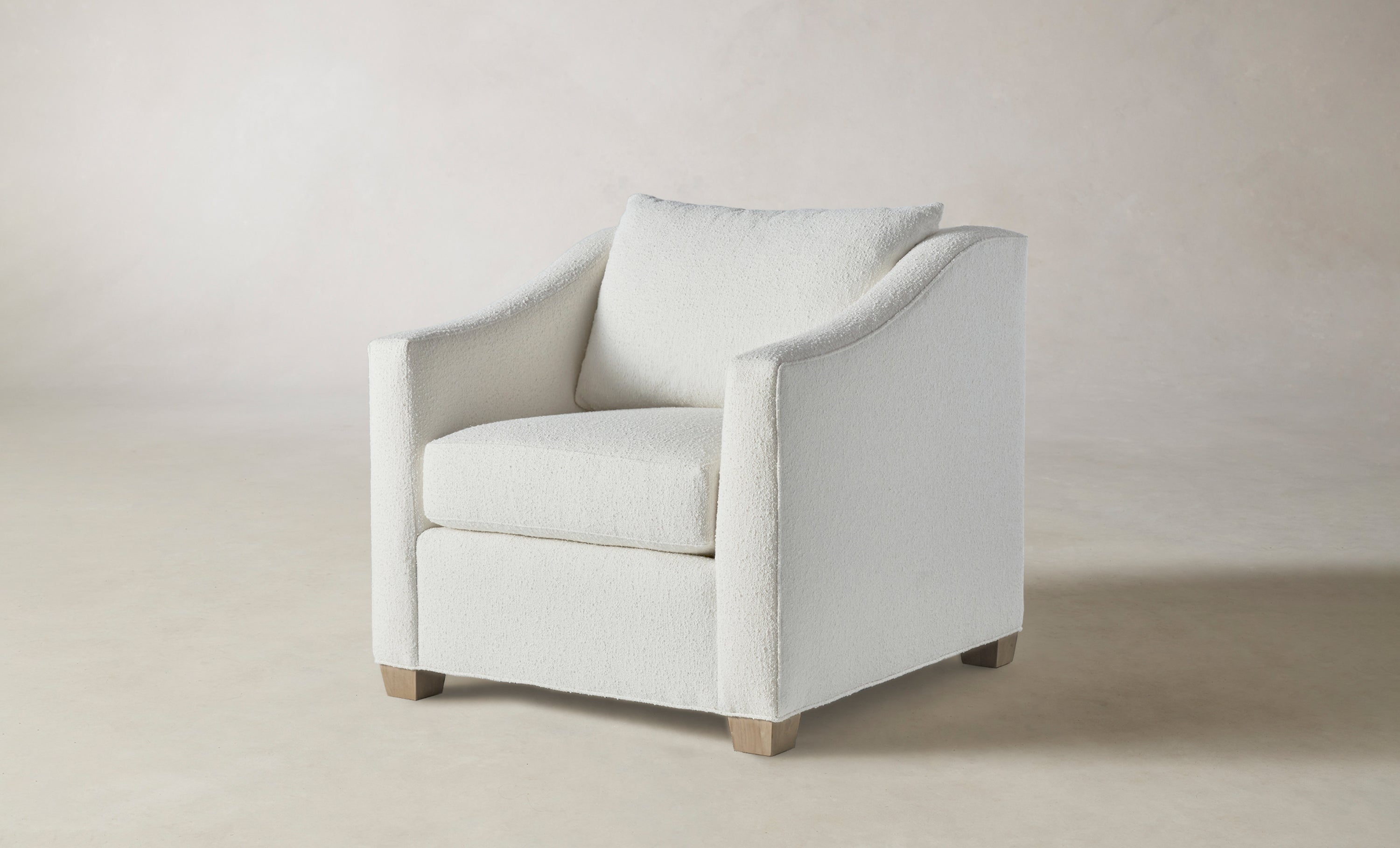 sullivan accent chair in white boucle with wooden legs