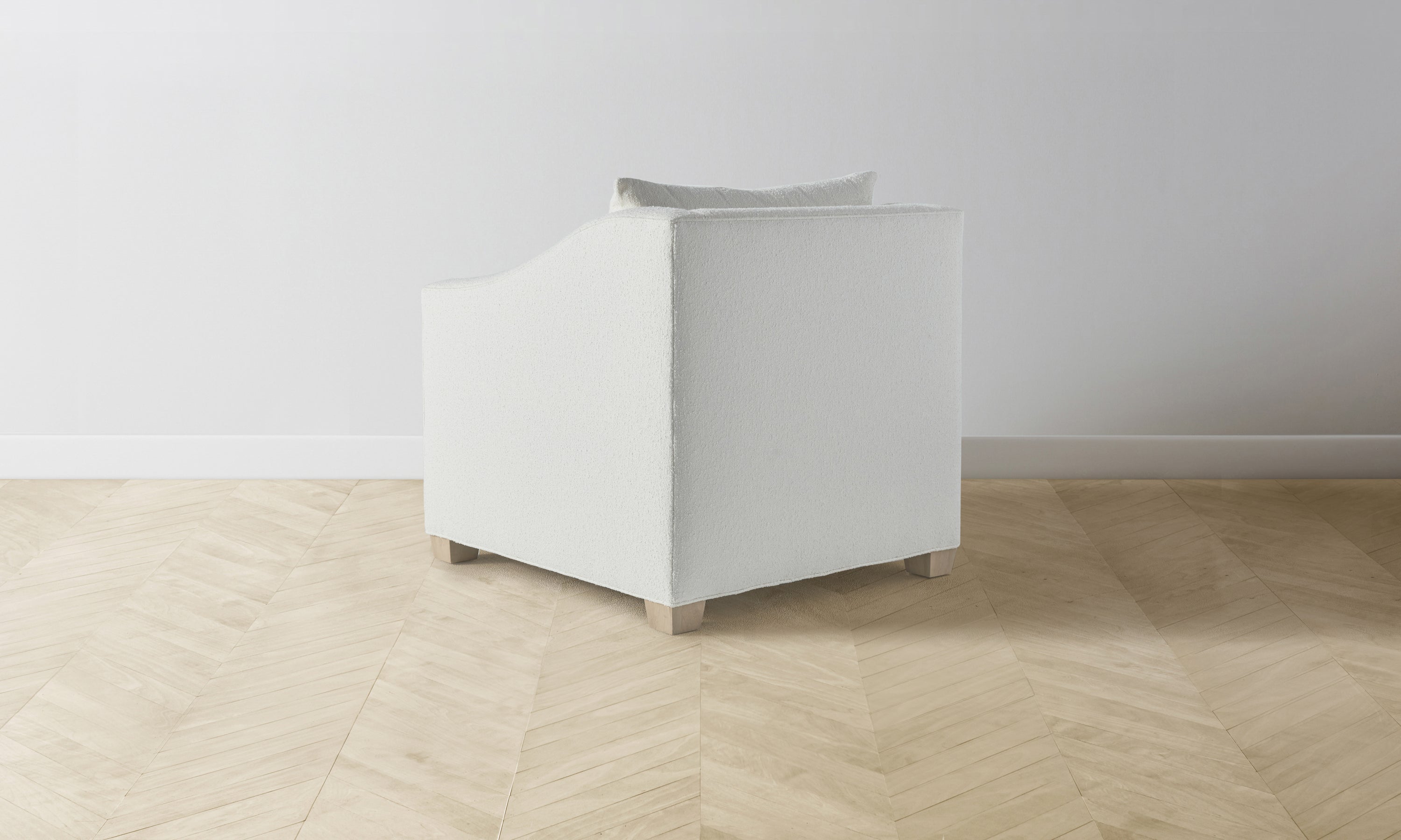 sullivan accent chair in white boucle with wooden legs - back view