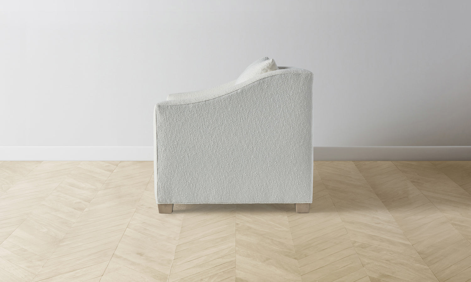sullivan accent chair in white boucle with wooden legs - side view