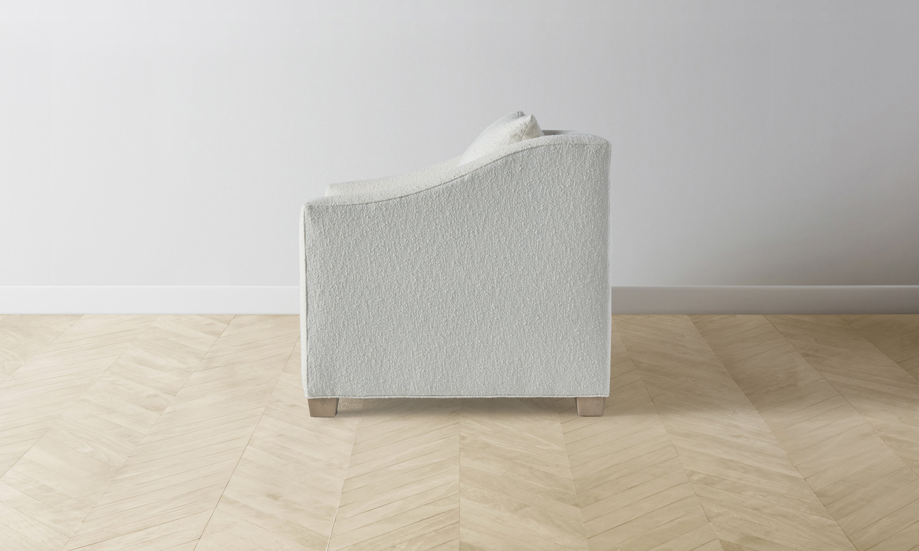 sullivan accent chair in white boucle with wooden legs - side view