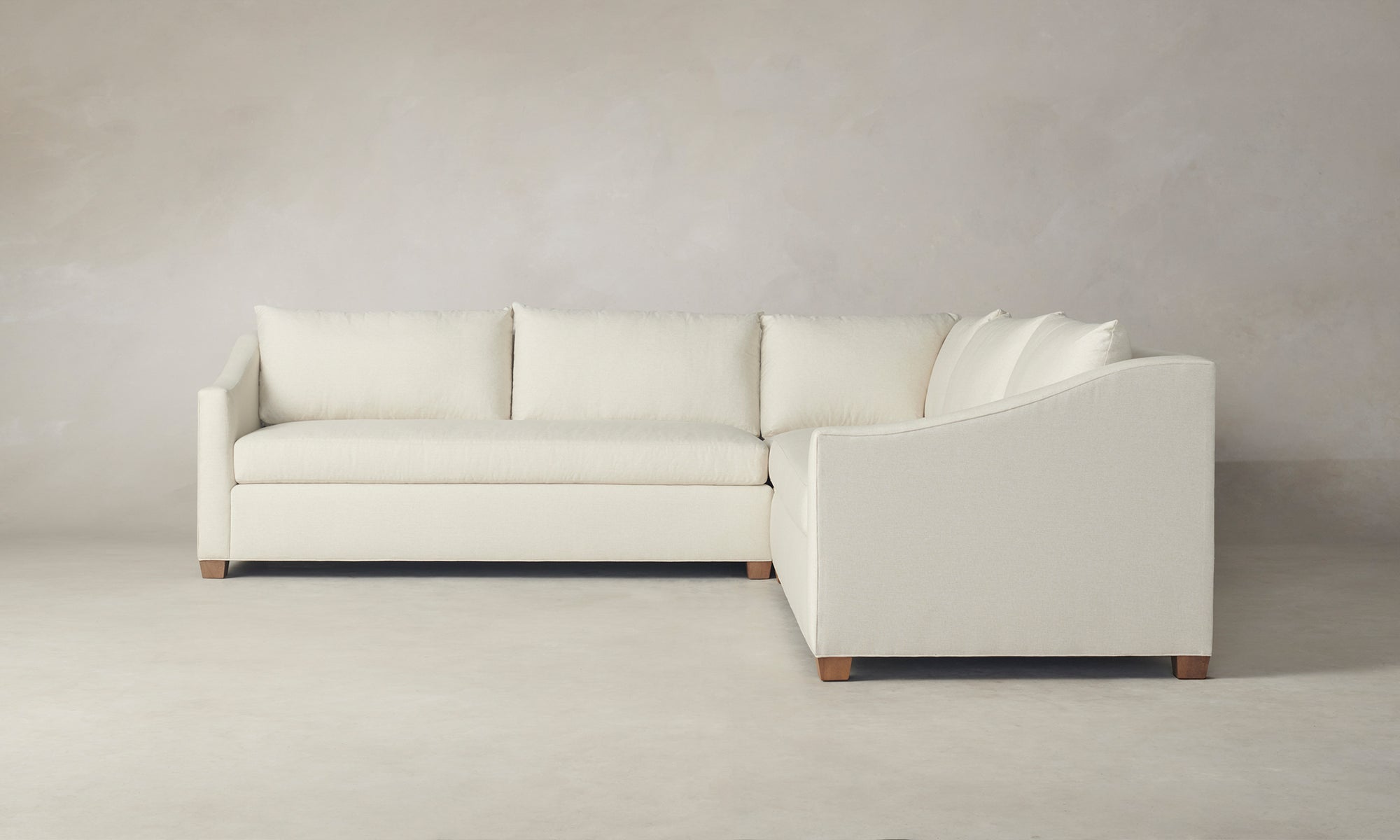sullivan sectional sofa in white melange weave fabric with wooden legs