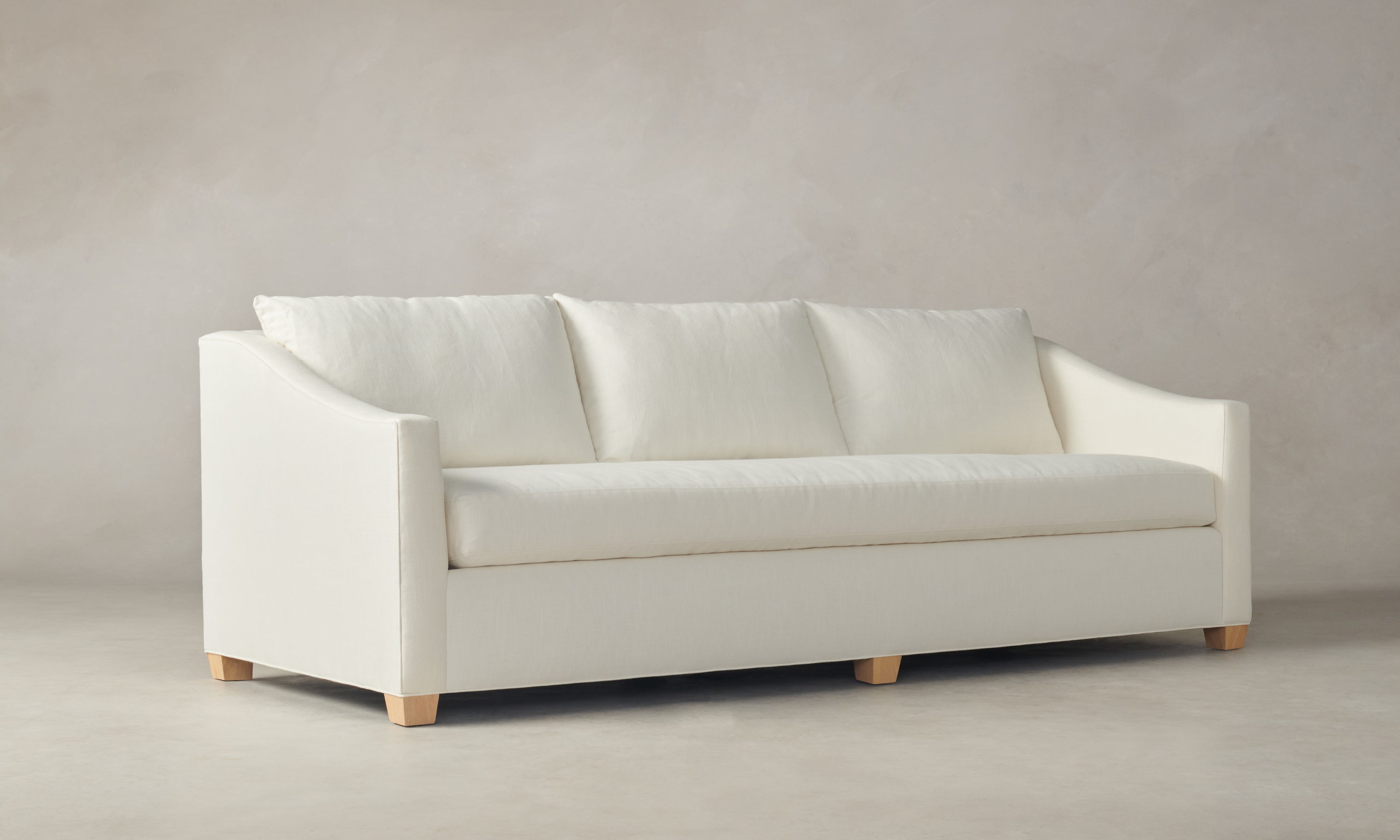 sullivan off-white linen sofa with wooden legs and 3 seats - angle view