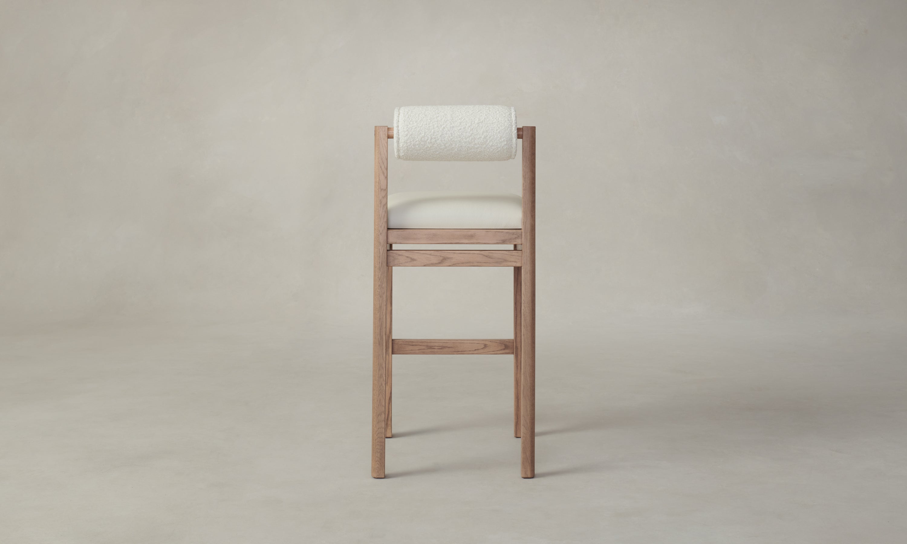 thayer wood barstool in oak with white leather seat and boucle back, back view