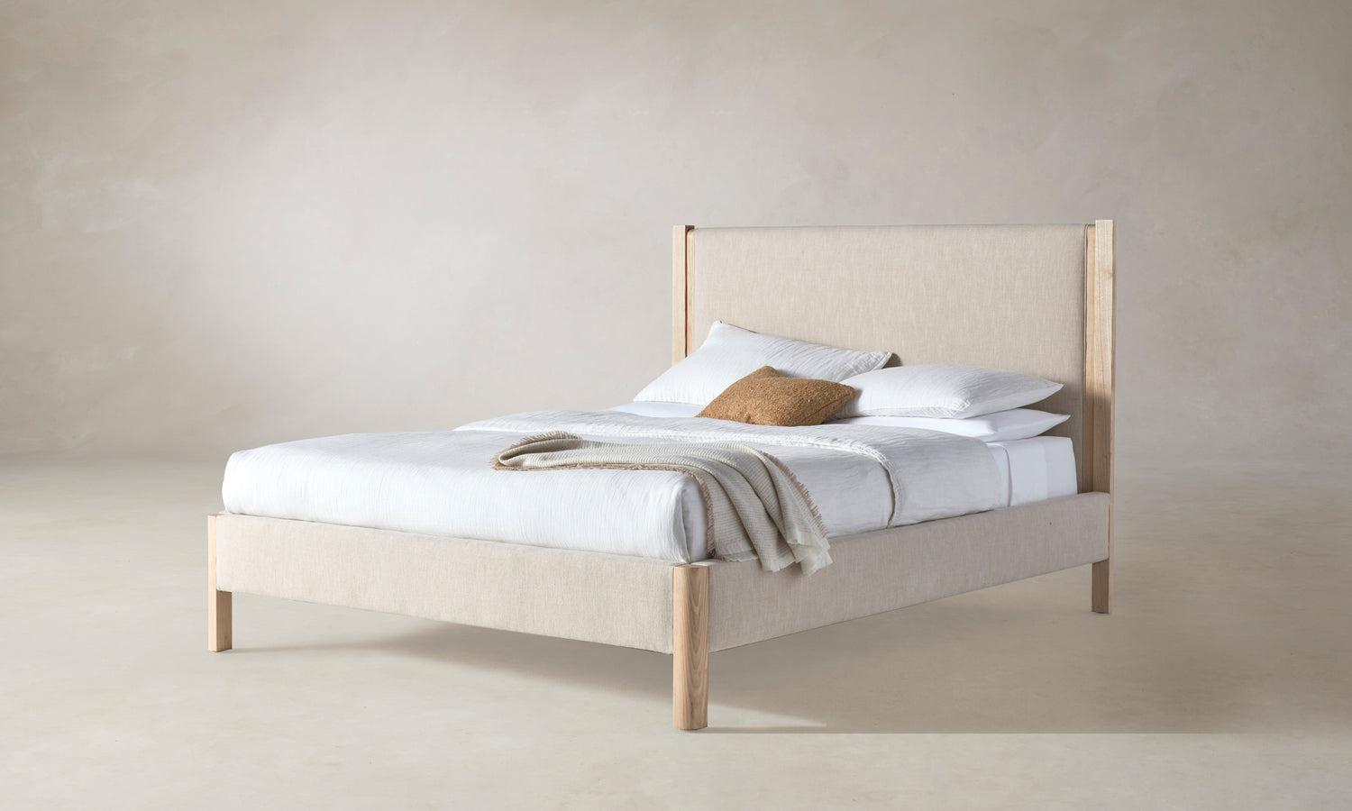 thompson upholstered bed in beige linen with ash wood legs